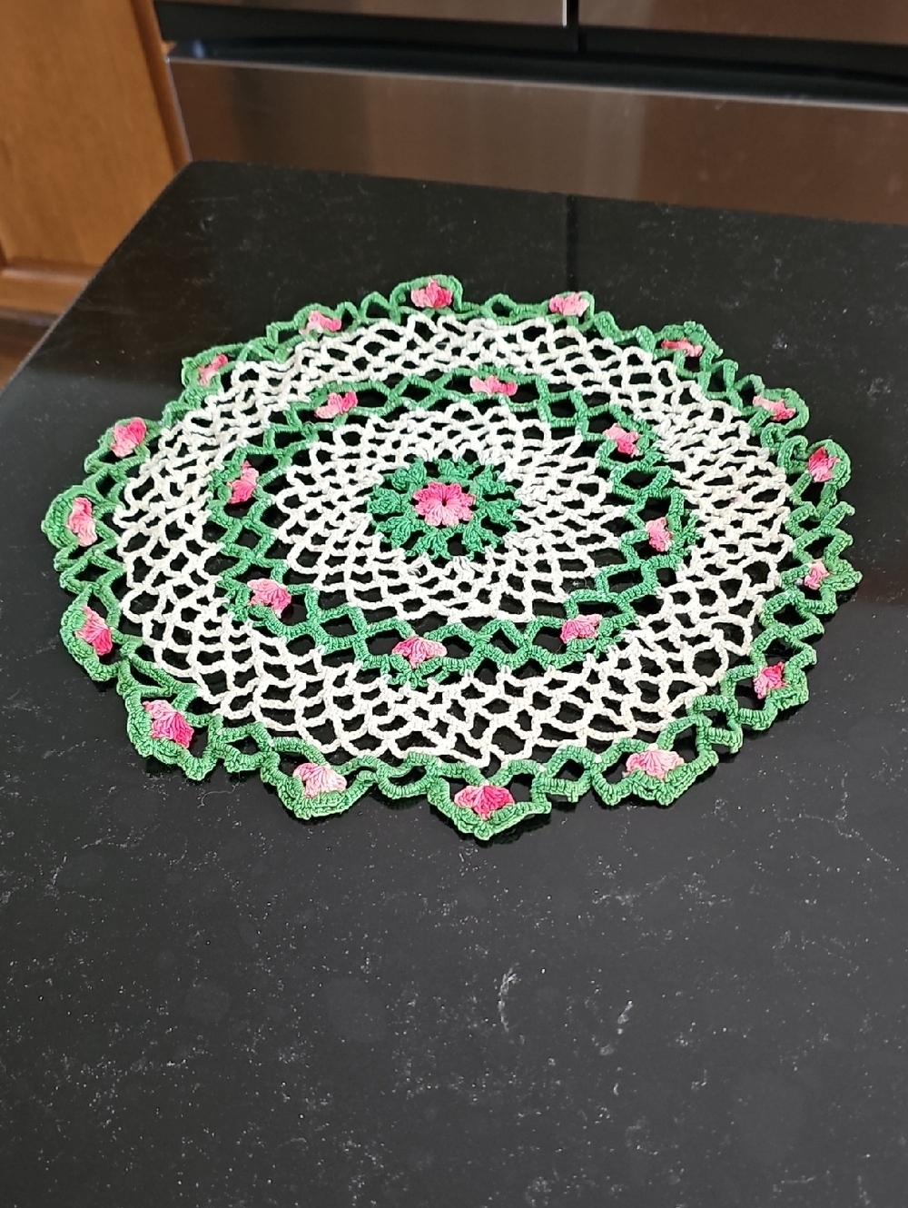 Handmade Crochet Doily with Green and Pink Accents